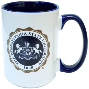 white mug with Pennsylvania State University seal with navy interior and handle